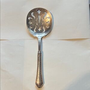 Elegant Sterling Silver Slotted Serving Spoon (71 grams)
9 inches long